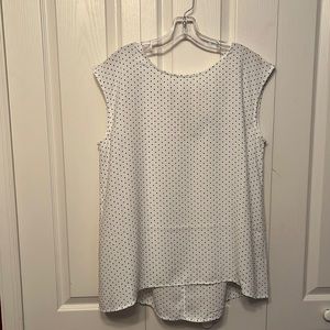 White sleeveless top with black polka dots